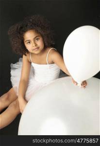 Cute little girl holding a balloon