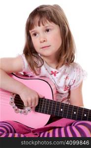 Cute little girl holding a guitar