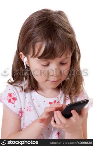 Cute little girl holding a mp3 player and listening to music