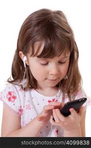 Cute little girl holding a mp3 player and listening to music
