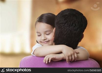 Cute little girl hugging her father