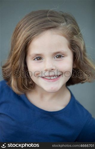 Cute little girl in a summer day smiling at camera