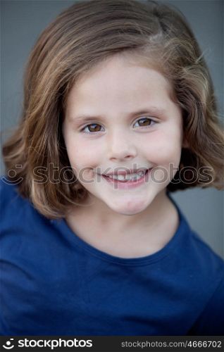 Cute little girl in a summer day smiling at camera