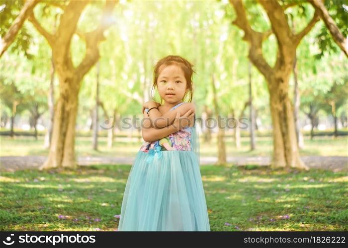 Cute little girl in the park on a sunny day