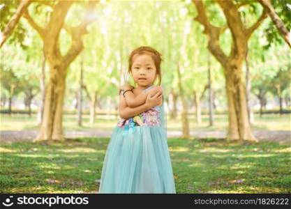 Cute little girl in the park on a sunny day
