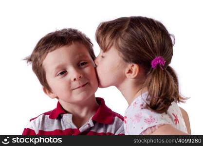 Cute little girl kissing a boy