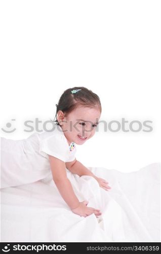 cute little girl on the bed at home
