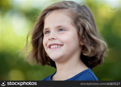 Cute little girl on the park in summer day