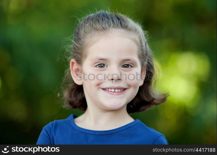 Cute little girl on the park in summer day