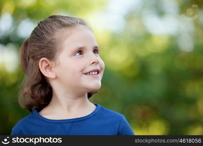 Cute little girl on the park in summer day