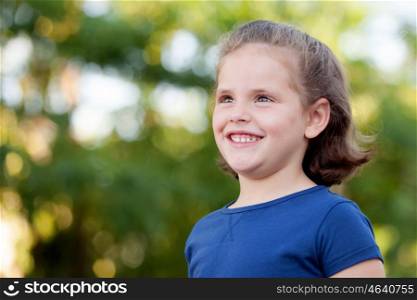 Cute little girl on the park in summer day