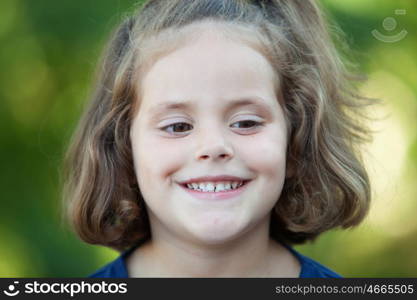 Cute little girl on the park in summer day