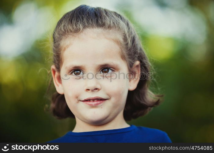 Cute little girl on the park in summer day