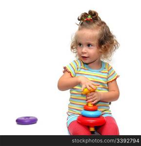 cute little girl playing with pyramid on white