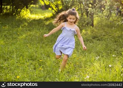 cute little girl running garden