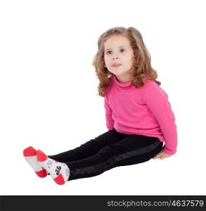 Cute little girl sitting on the floor isolated on a white background