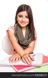 Cute little girl studying and smiling on desk