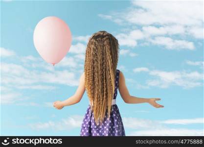 Cute little girl with a balloon