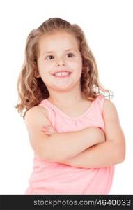 Cute little girl with crossed arms smiling on a white background