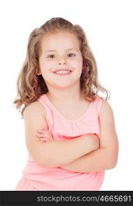 Cute little girl with crossed arms smiling on a white background