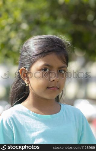 Cute little girl with long hair and black eyes