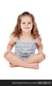 Cute little girl with three year old sitting on the floor isolated on a white background