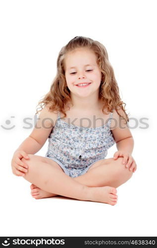 Cute little girl with three year old sitting on the floor isolated on a white background