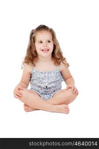 Cute little girl with three year old sitting on the floor isolated on a white background
