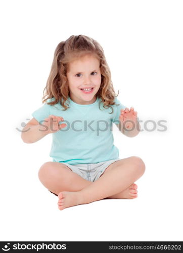 Cute little girl with three year old sitting on the floor isolated on a white background