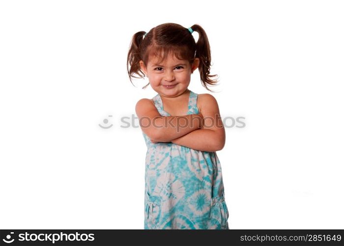 Cute little young toddler girl with attitude smirk, arms crossed and pigtails in hair, naughty rascal expression, isolated.