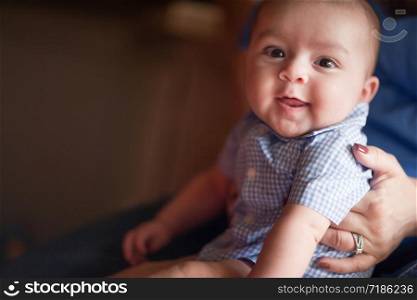 Cute Mixed Race Infant Having Fun with His Parents.