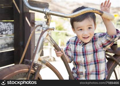 Cute Mixed Race Young Boy Having Fun on the Bicycle.