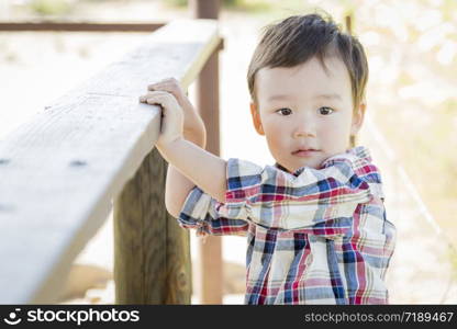 Cute Mixed Race Young Boy Having Fun Outside.