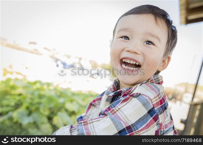 Cute Mixed Race Young Boy Having Fun Outside.