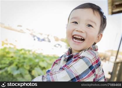 Cute Mixed Race Young Boy Having Fun Outside.