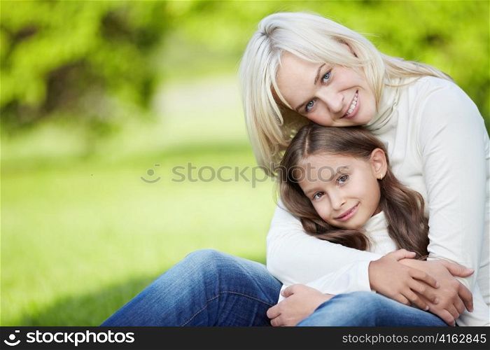 Cute mother and daughter outdoors
