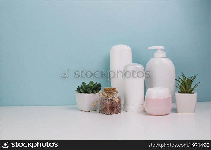 cute plants near cosmetics bottles. High resolution photo. cute plants near cosmetics bottles. High quality photo