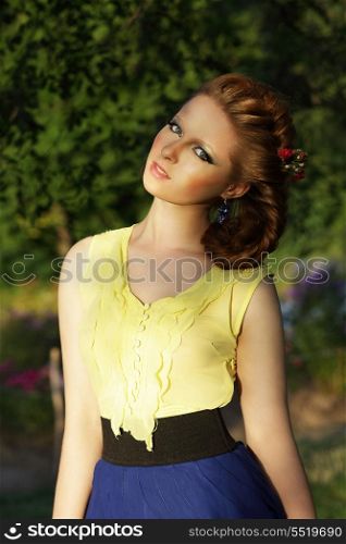 Cute Romantic Young Woman in Sleeveless Sundress Outdoors