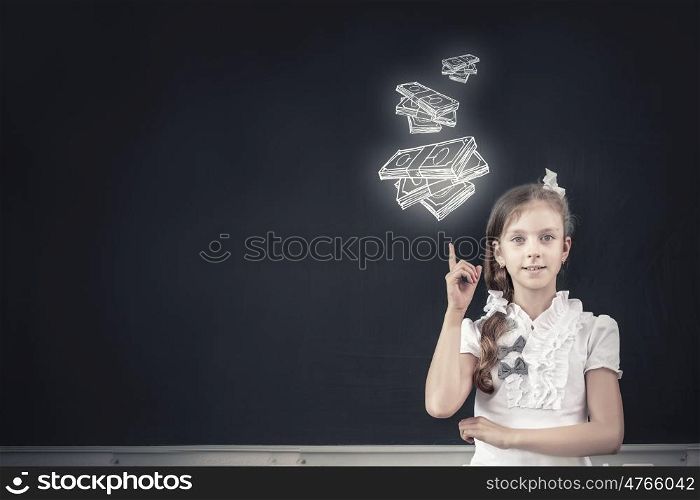 Cute school girl and drawn money banknotes on blackboard. Money science