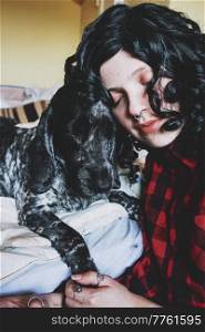 Cute shot of a young woman spending time with her dog

