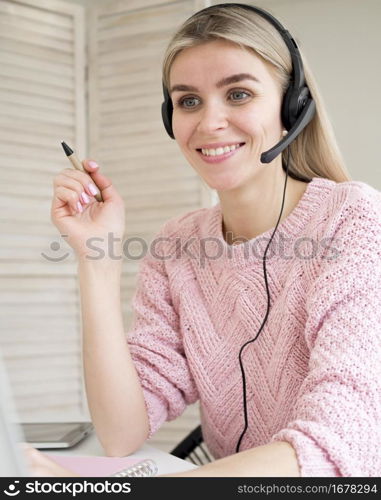 cute smiley student wearing headphones e learning concept