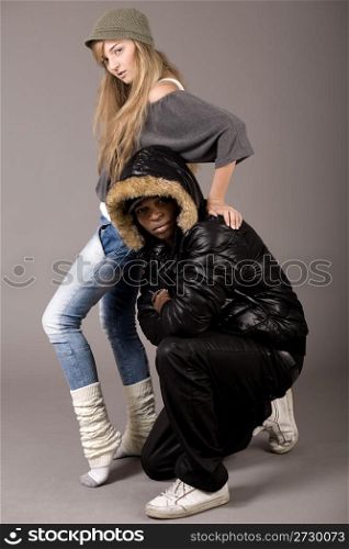 Cute still of a black man and caucasian women on grey background