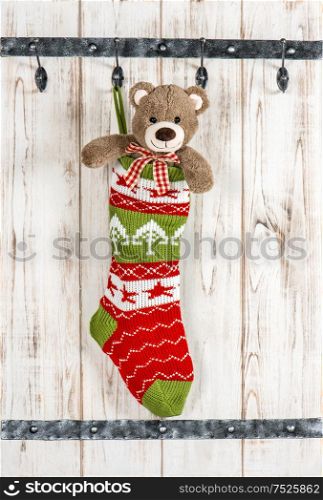 Cute Teddy Bear with christmas stocking sock. Vintage style decoration