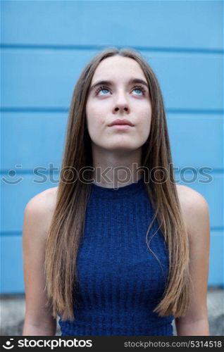 Cute teenager girl with long and straight hair outside