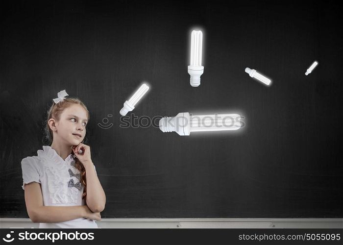 Cute thoughtful school girl and light bulb above her head. Let me think