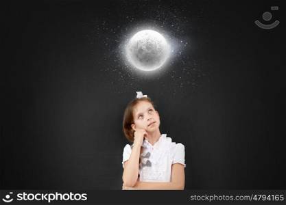 Cute thoughtful school girl and moon above her head. Let me think