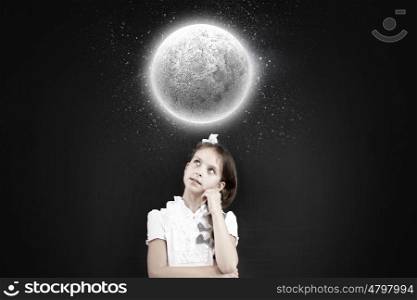 Cute thoughtful school girl and moon above her head. Let me think