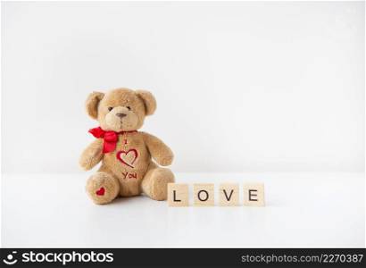 Cute toy teddy bear with a heart isolated on a white background. Love lettering, Valentine&rsquo;s Day holiday concept. Cute toy teddy bear with a heart isolated on a white background. Love lettering, Valentine&rsquo;s Day holiday concept.