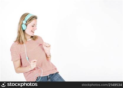 cute woman dancing with closed eyes