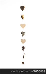 Cute wooden angel cupid and hearts decor isolated on white background, Theme of love. Valentine’s day.. Cupid and heart decor in white